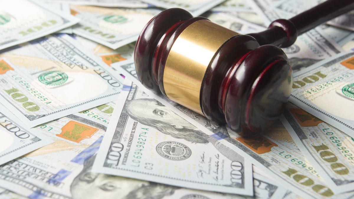 Judges Or Auctioneer Gavel On The Dollar Cash Background